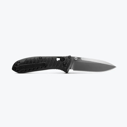 Folding knife with a black handle and silver blade on a white background