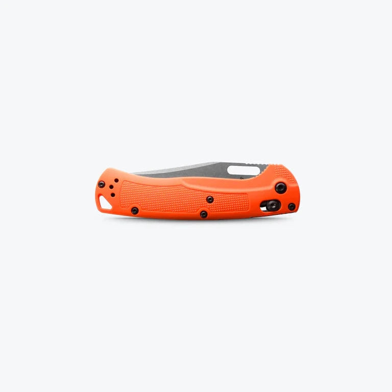 Orange folding knife on a white background