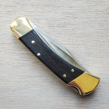 Buck 110 Folding Hunter 3.75" Lockback Ebony Leather Sheath